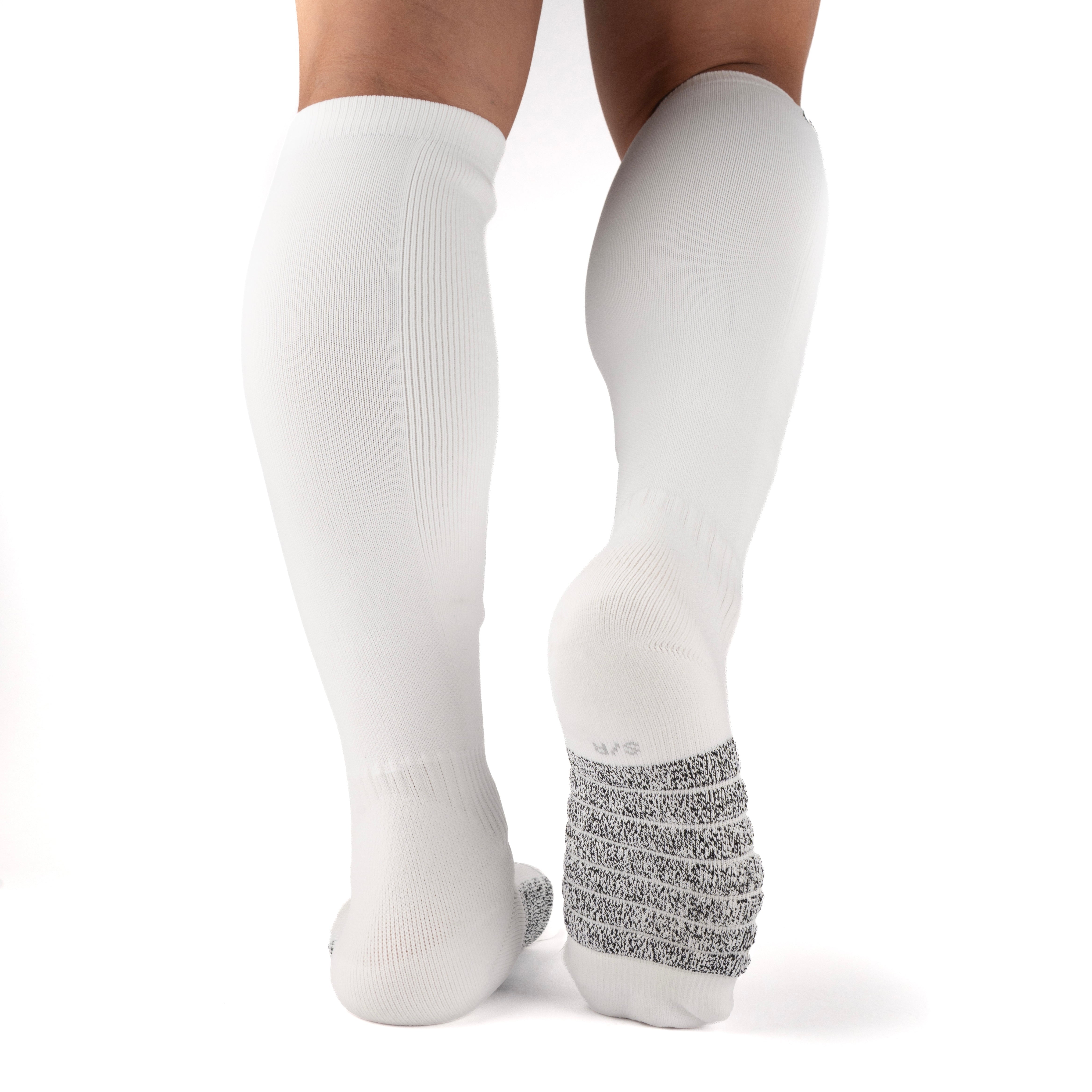 White Performance Deadlift Socks worn on model, rear view showing high-friction footbed
