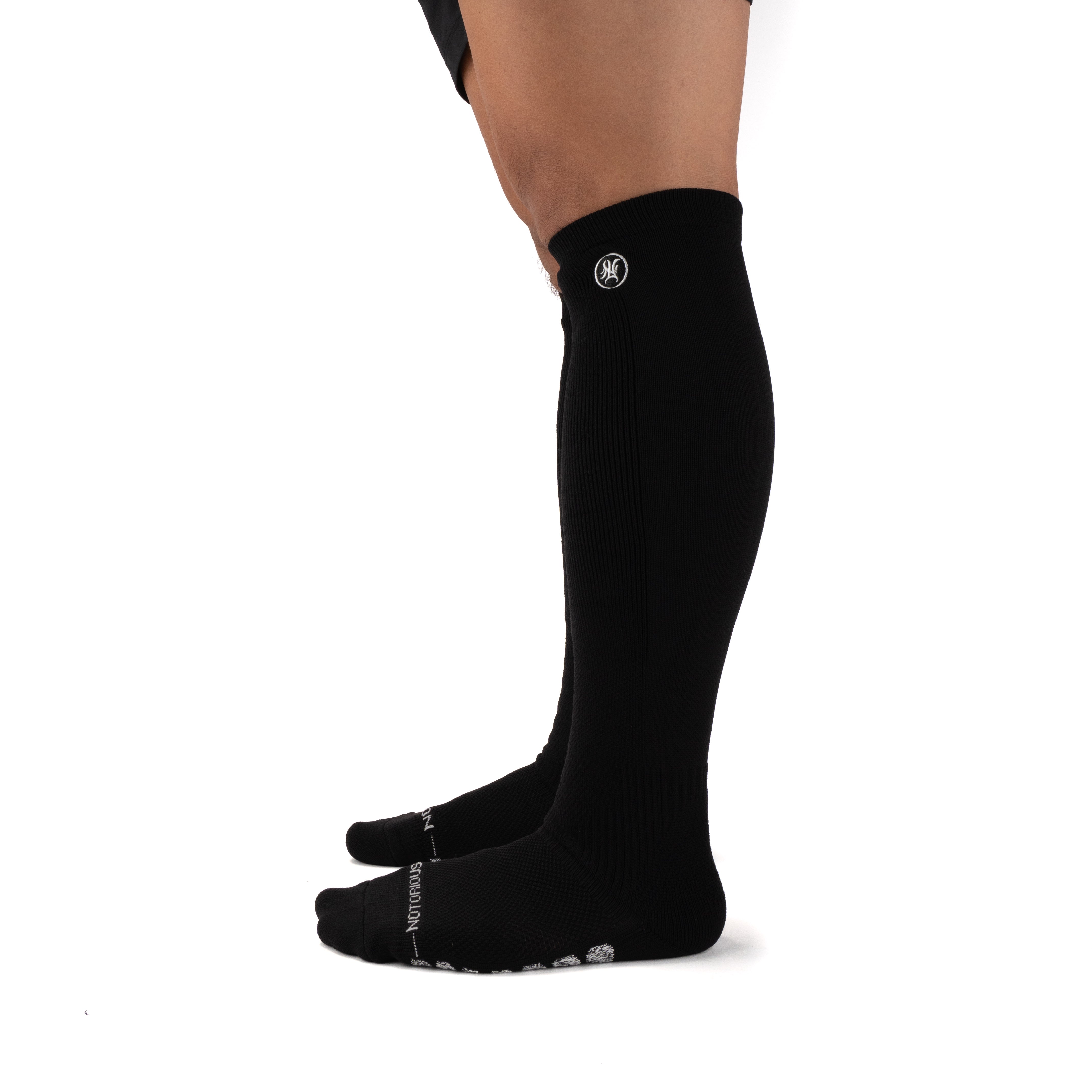 Black Performance Deadlift Socks worn on model, side view