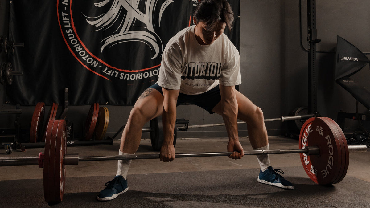 Athlete pulling a deadlift in Radix Pro powerlifting shoes