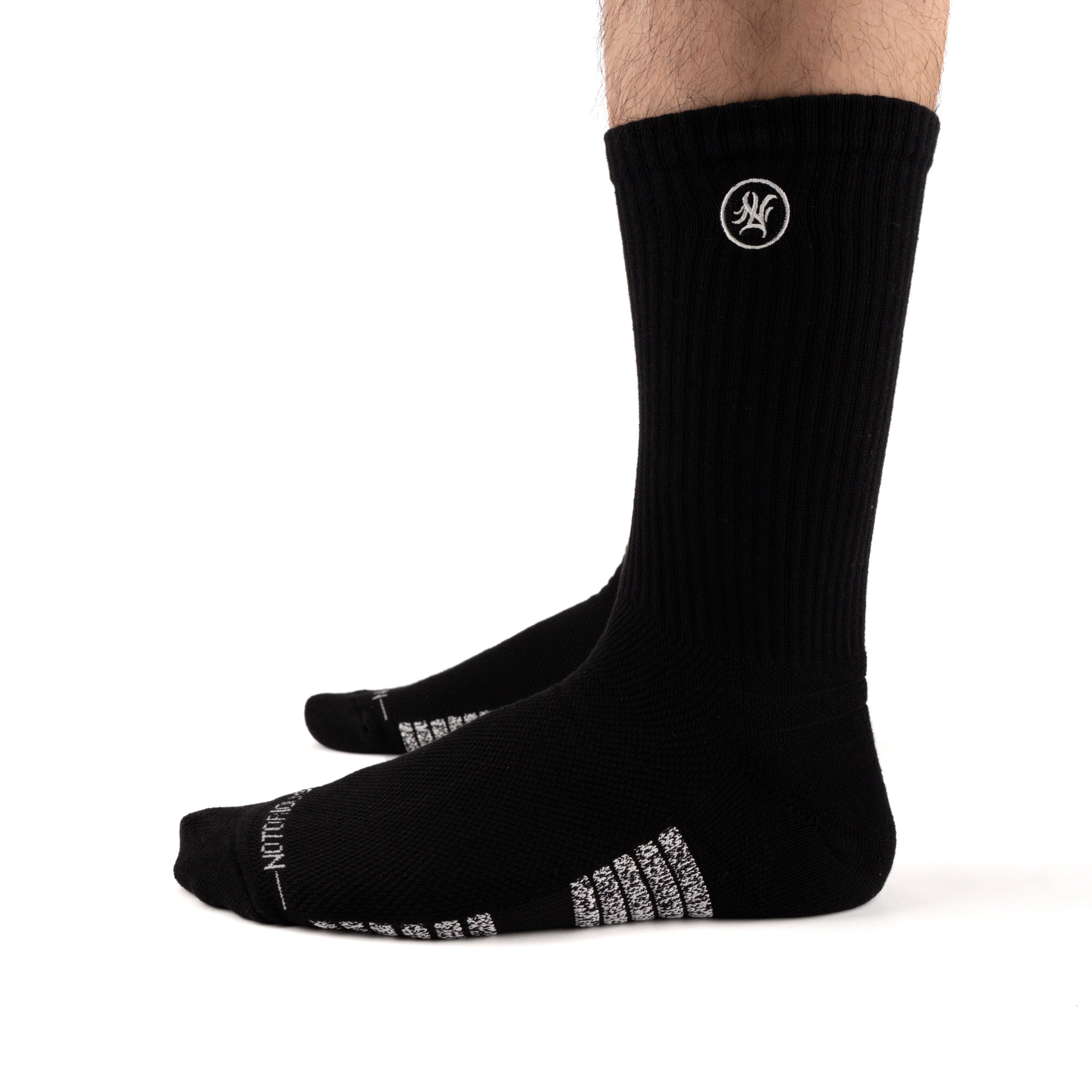 Black Performance Crew Socks worn on model, side view