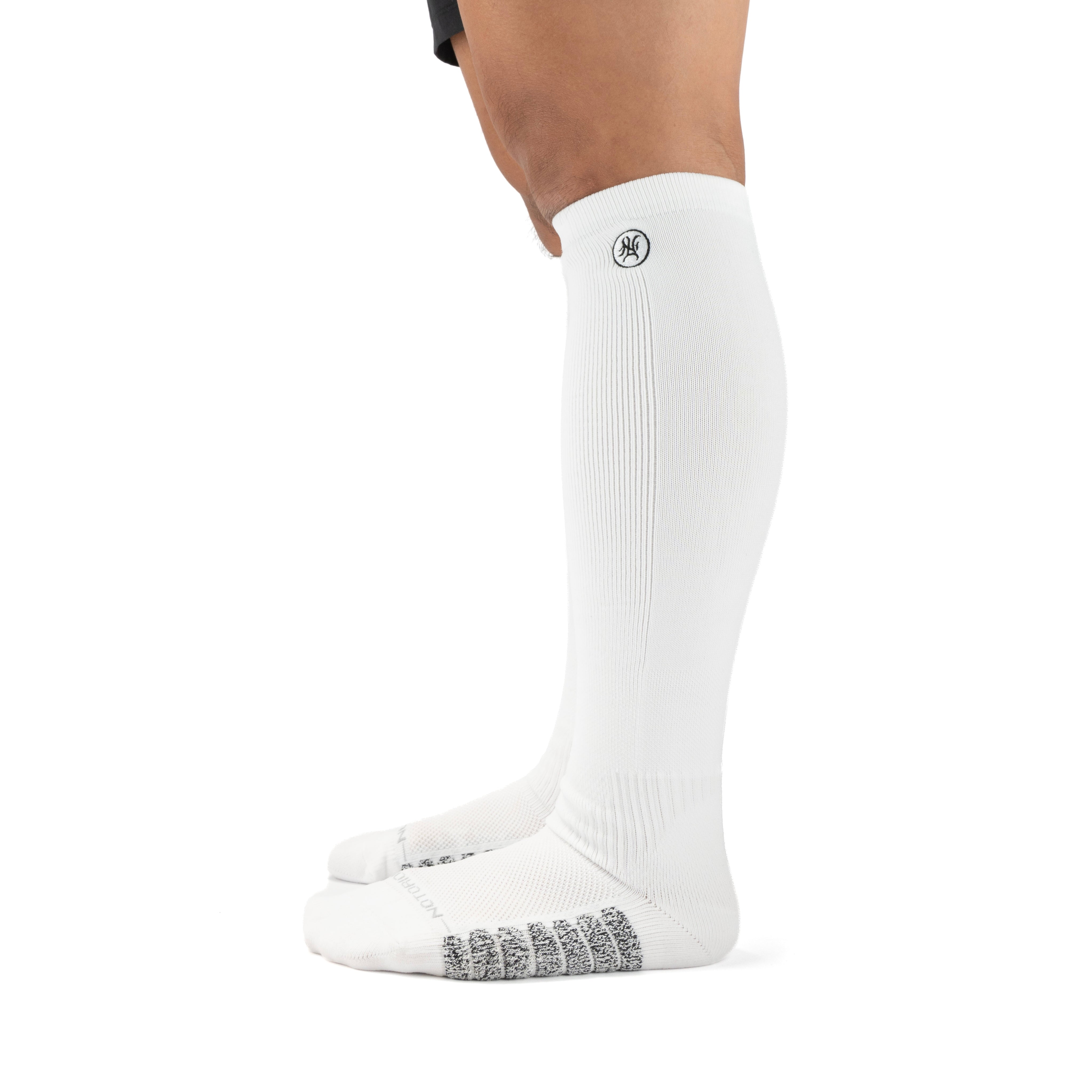 White Performance Deadlift Socks worn on model, side view