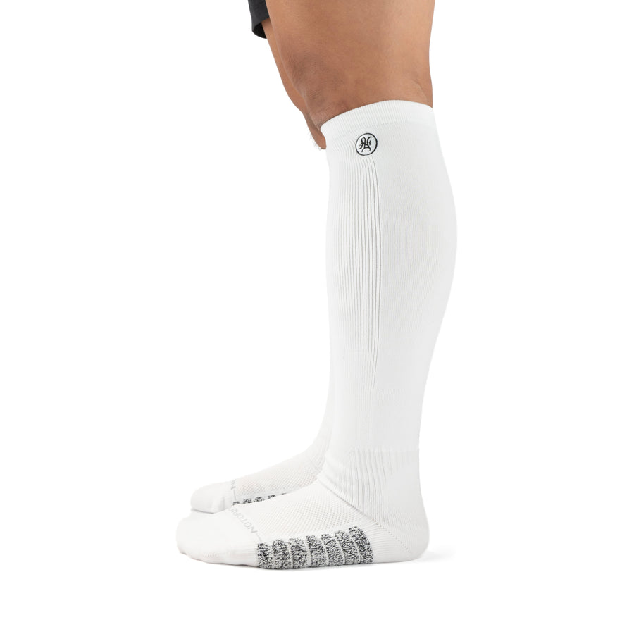 White Performance Deadlift Socks worn on model, side view